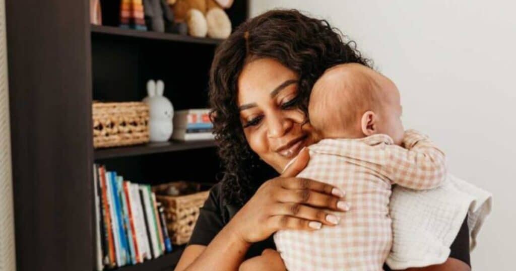 nanny burping and caring for newborn