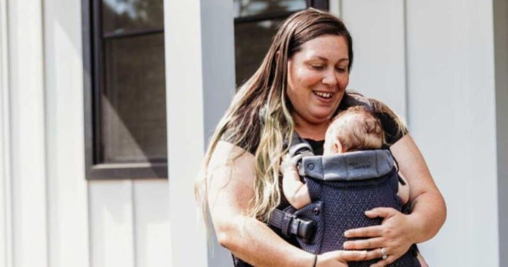 mom babywearing baby front