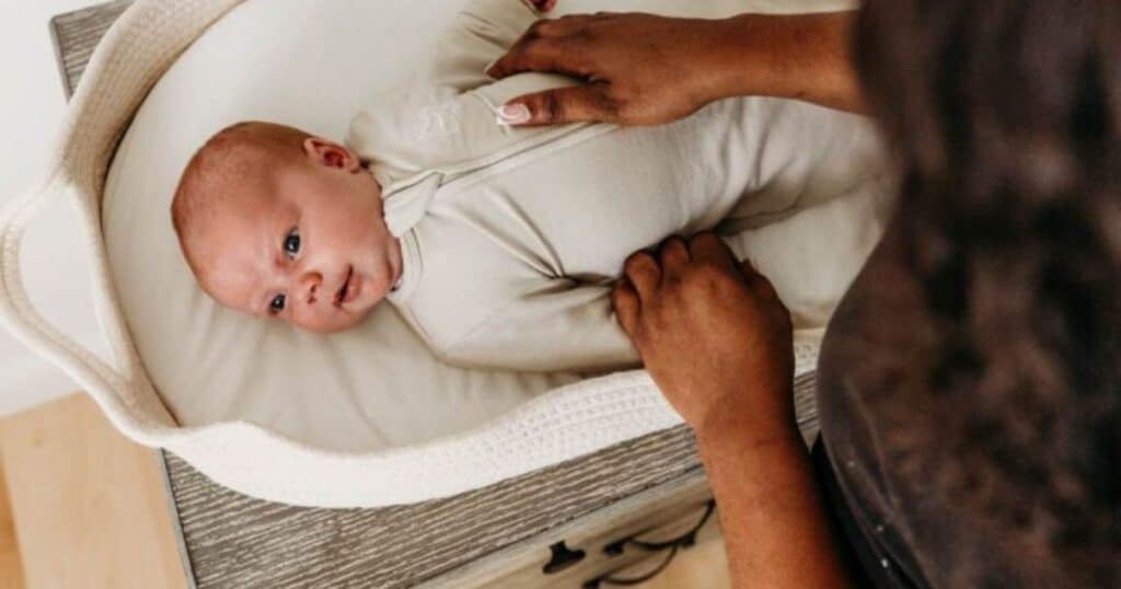 night nanny with baby in cradle