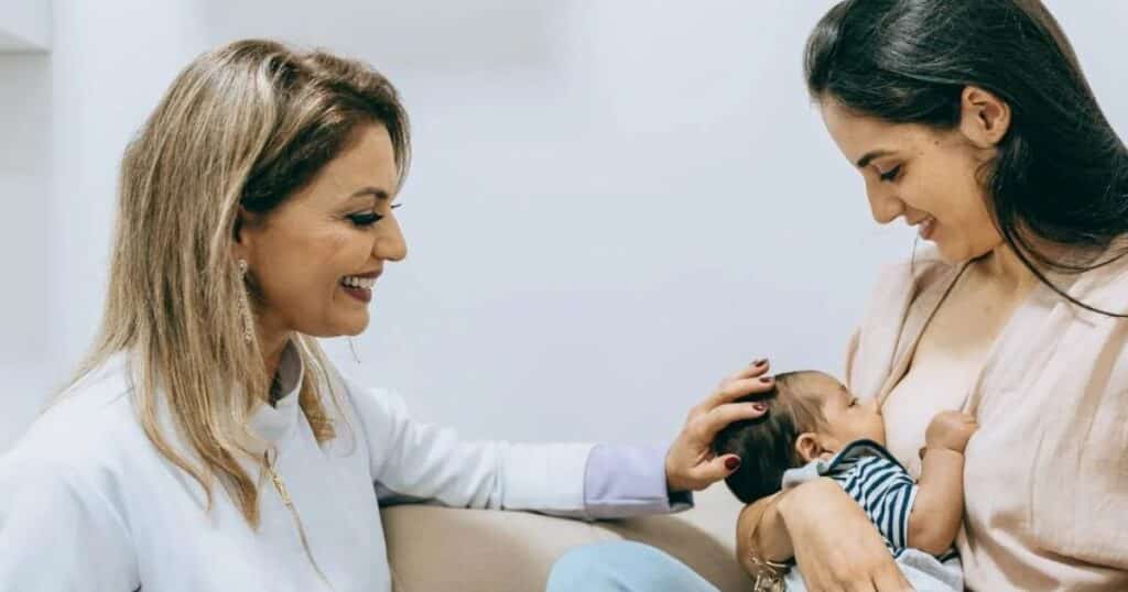 pediatrician with new mom and baby
