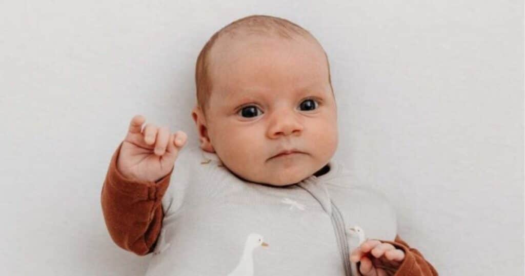 baby in swaddle wrap gown