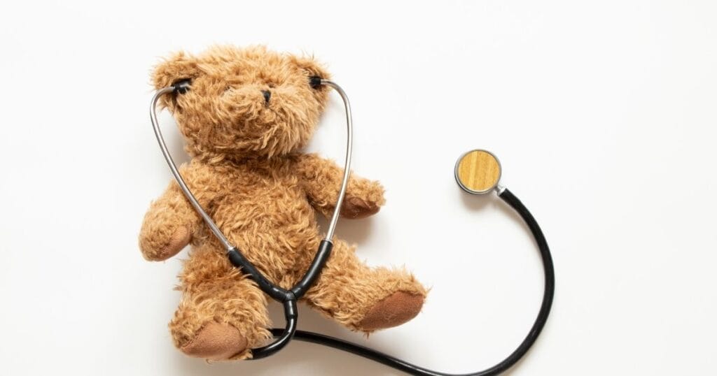 Brown teddy bear with black with black stethoscope