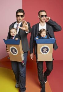 Parents and kids in presidential and special security costumes.