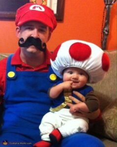 Dad and baby as Mario and Toad.