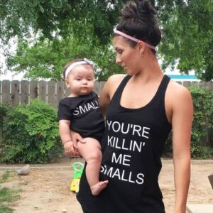 Mom and baby in costumes inspired by the Sandlot.