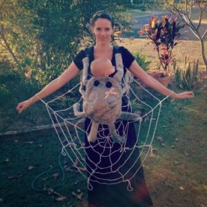 Mom and baby in spider and web costume.