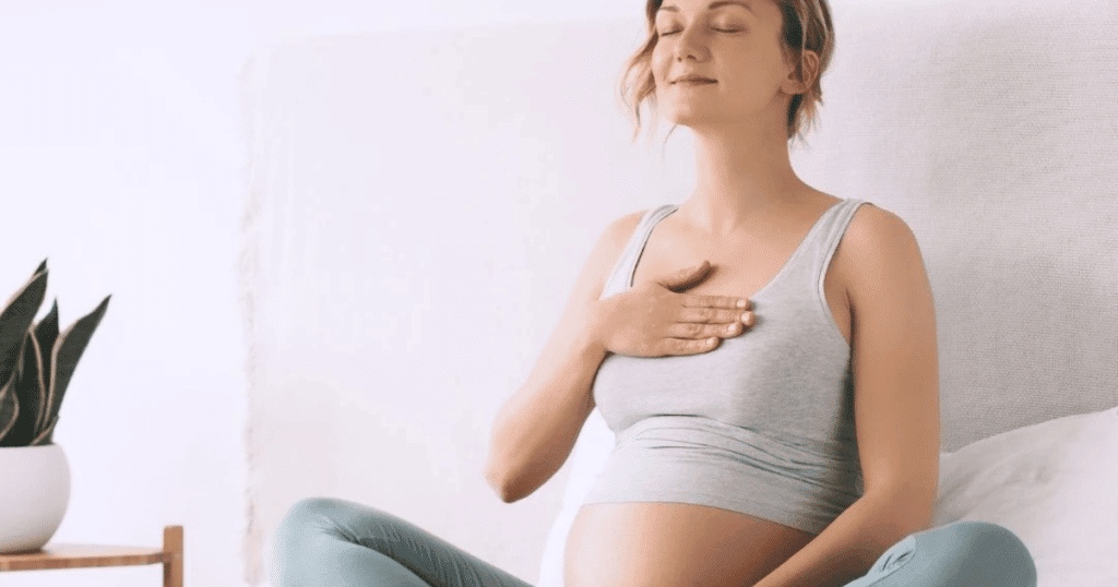 Pregnant woman doing Reiki.
