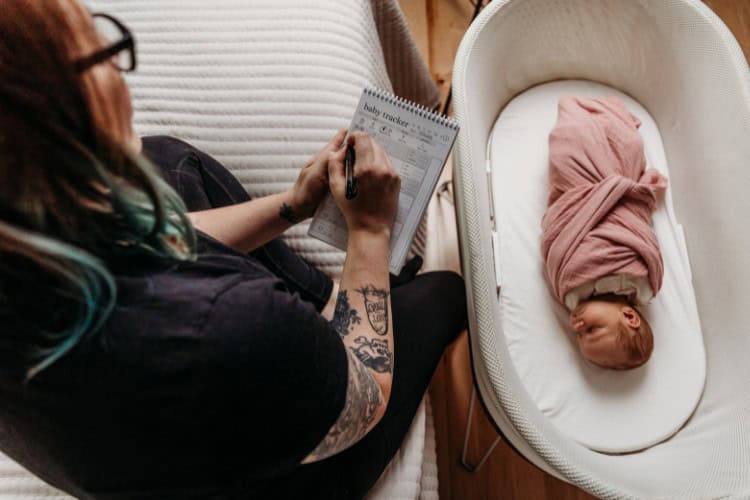 Newborn care specialist observing newborn.