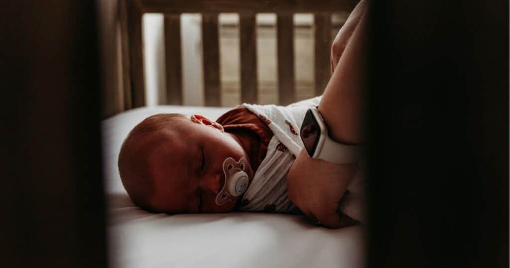 sleeping baby at night in crib