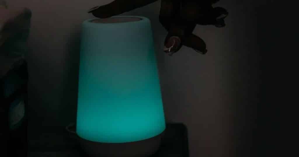 Parent turning on white noise machine.