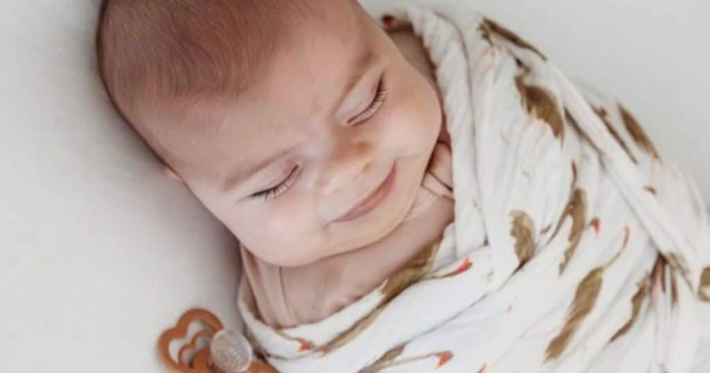 baby in swaddle sleeping at night