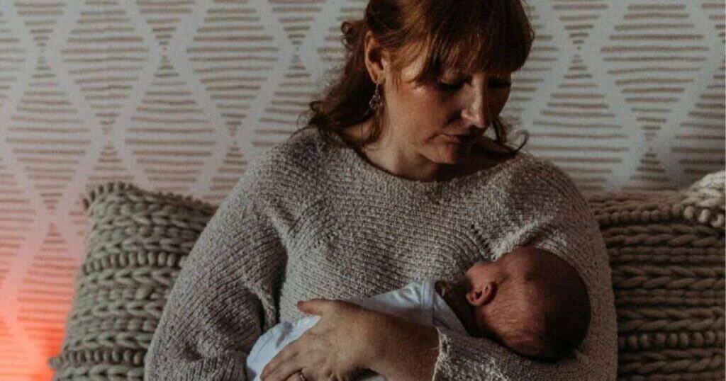 night nurse holding baby during overnight shift