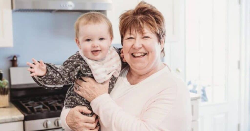 nanny smiling with baby during nanny celebration week