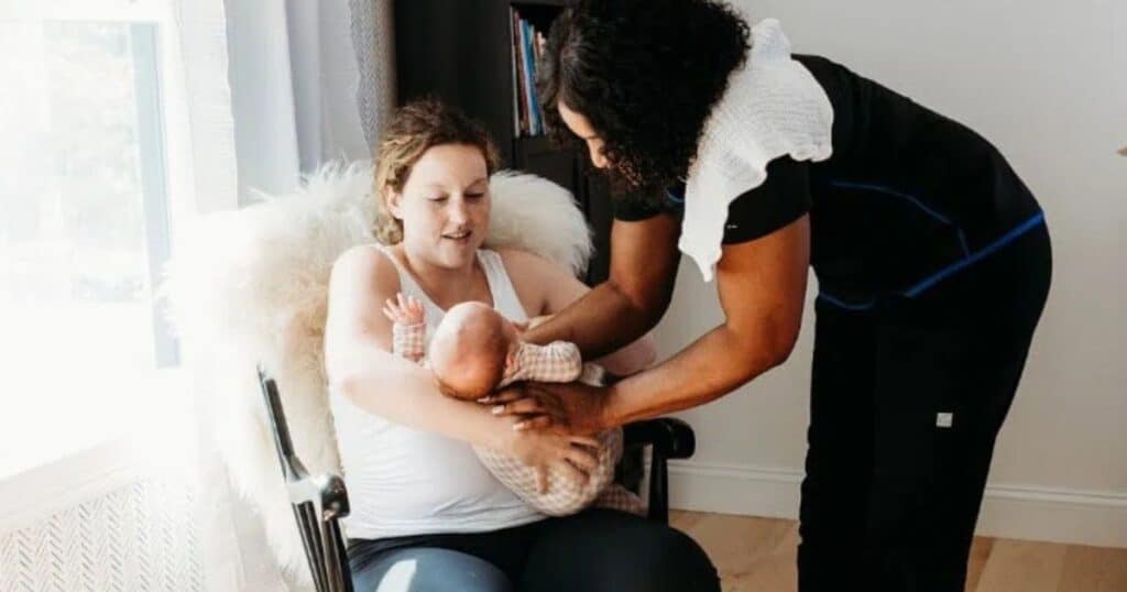 doula with carrot fertility helping new mom with her baby
