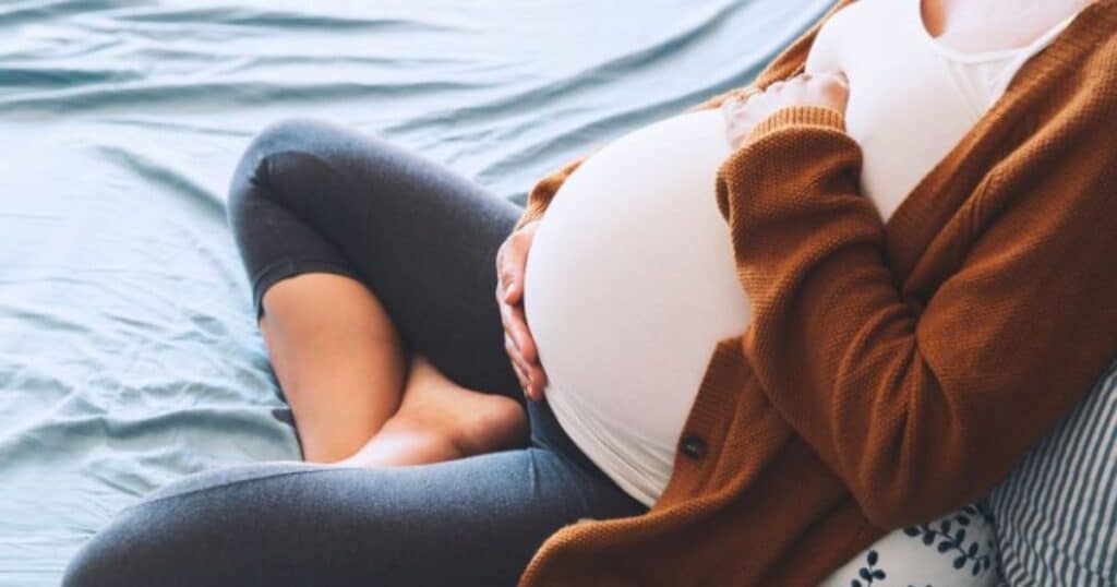 pregnant woman on her due date wondering about natural ways to induce labor