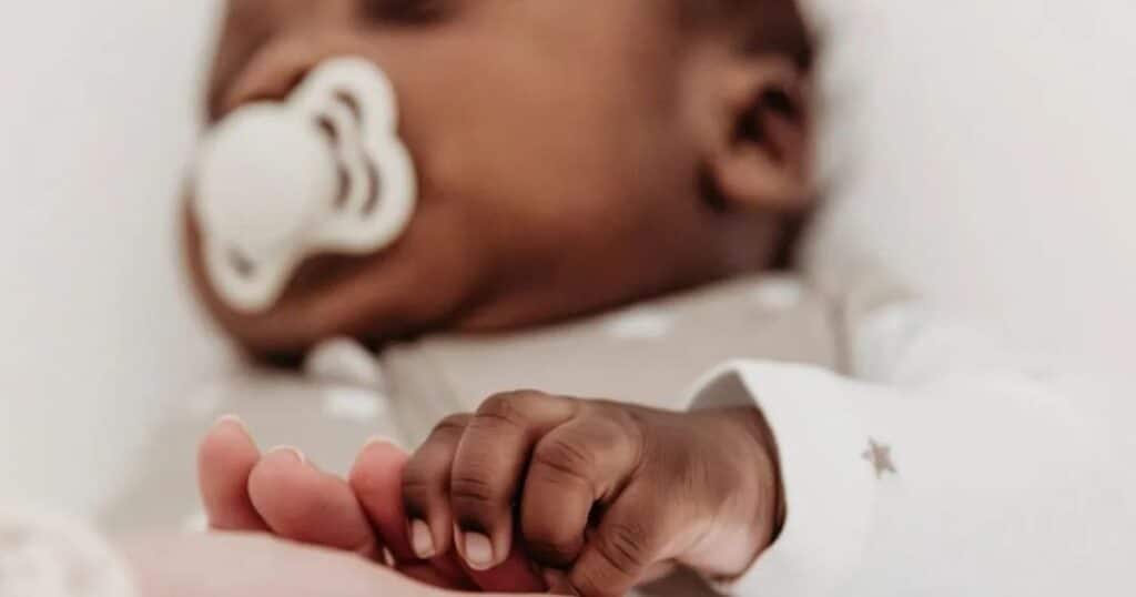 sleeping baby with pacifier