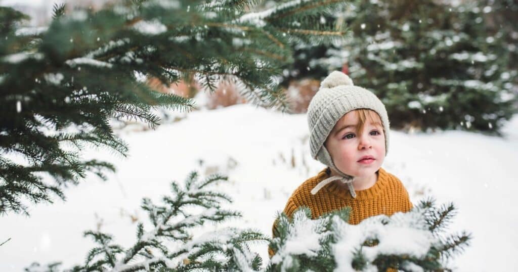 baby in snow at holiday event in rhode island