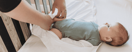waddling baby in crib
