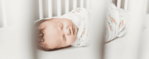 waddled baby in crib