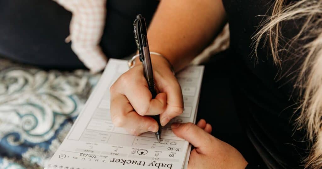 Newborn Care Specialist from Well Supported Family using printed baby tracker
