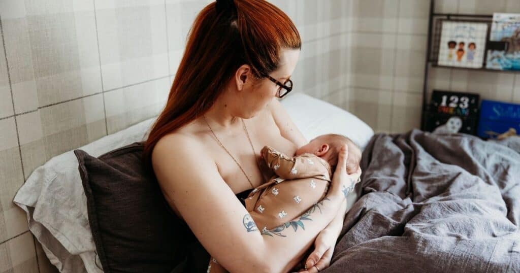 New mother breasfeeds baby