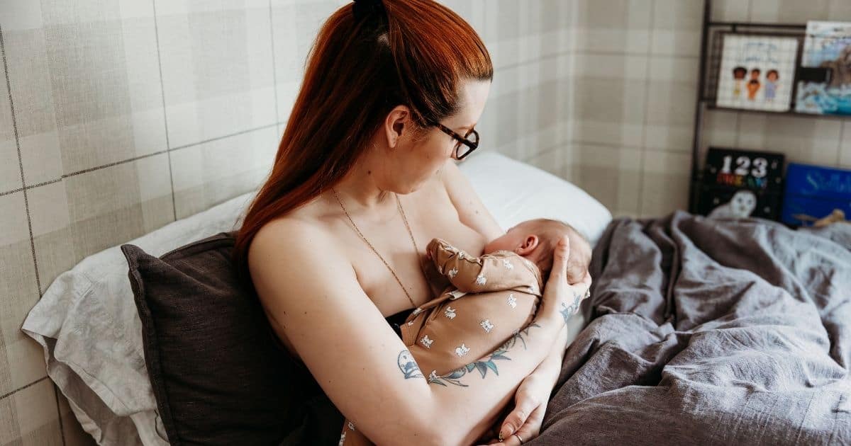 New mother breasfeeds baby