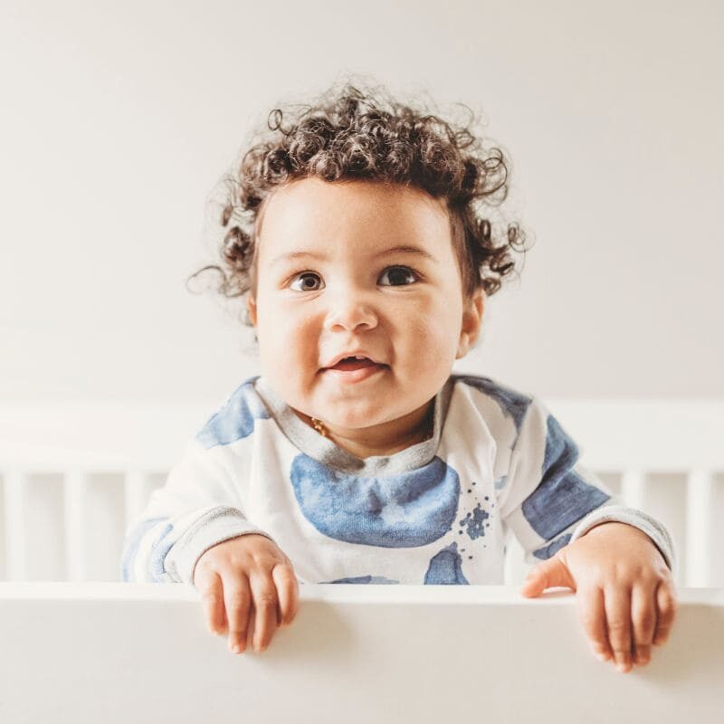 awake baby in crib