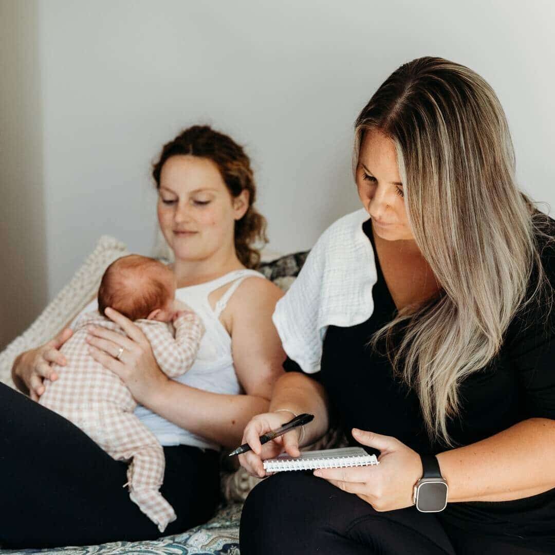 night nurse with mom taking detailed notes of feeds and schedule