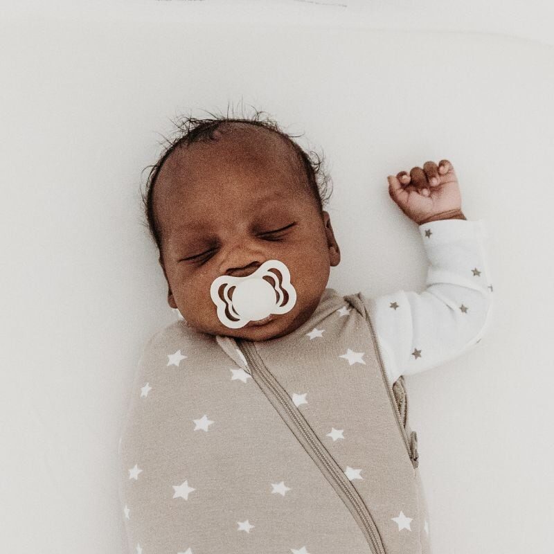 sleeping newborn in swaddle
